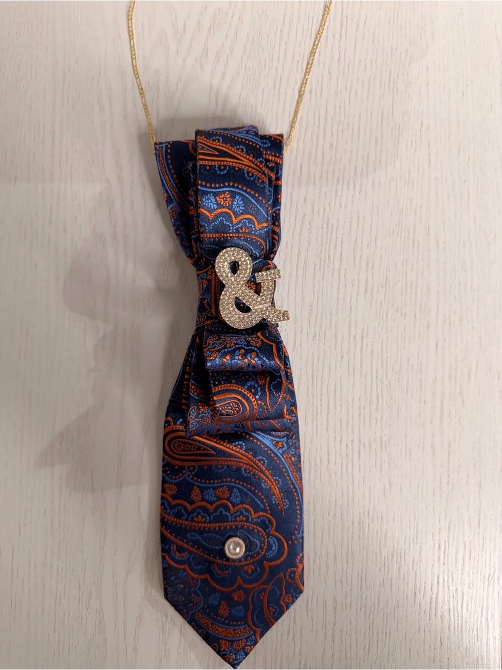 Elegant Navy Blue & Orange Paisley Pendant Necklace with Gold Accents
Handmade